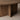 Clara Oval Walnut Dining Table, close-up of walnut wood grain and base detail