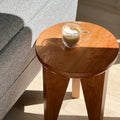 Close-up of Tres End Table's craftsmanship, highlighting natural wood grain in cherry finish