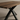 Wooden table with black metal legs on a beige background