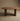 Ovali oval solid wood dining table in walnut, front view, handcrafted in Canada