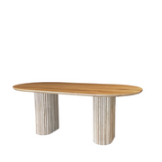 Front view of the OVALI oval dining table in whitened oak, demonstrating its unique colour and the classic lines of its design.