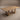 Pandi split-top dining table in white oak, angled view of the two-plank top and open frame legs, handcrafted in Canada by ref.
