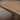 Close-up of the Pandi dining table split-top reveal and white oak grain, 3% matte finish, handcrafted in Canada by ref.