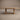 Pandi solid wood dining table in white oak, front view showing rectangular frame legs and low stretcher, handcrafted in Canada by ref.