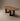 Wooden table with a minimalist design on a plain background