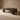 Dark wooden coffee table on a beige background