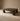 Dark wooden coffee table on a beige background